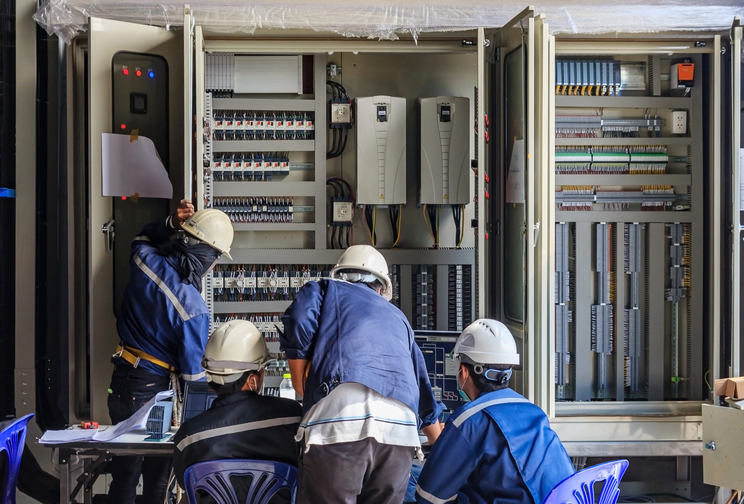 LPC-80760505_l-Stock Photo - Engineer working on checking and maintenance equipment at wiring on PLC cabinet, Engineer checking status step